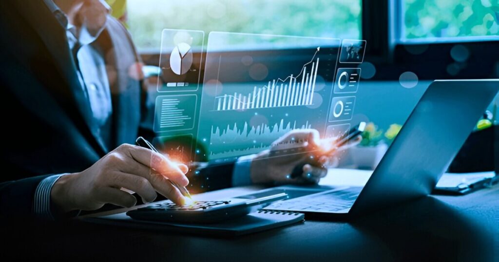 Barras ascendentes en una pantalla con íconos financieros, representando crecimiento económico
